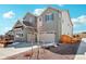Side view of this charming two-story home with a two-car garage and well-maintained lawn at 6361 Kenzie Cir, Castle Pines, CO 80108