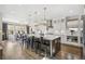 Gourmet kitchen with stainless steel appliances, a spacious island, and a breakfast bar at 6361 Kenzie Cir, Castle Pines, CO 80108