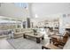 Open-concept living room offering ample space and natural light, connecting to the kitchen at 6361 Kenzie Cir, Castle Pines, CO 80108