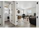 Bright living room showcasing hardwood floors and natural light through the window at 6361 Kenzie Cir, Castle Pines, CO 80108