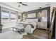 Spacious main bedroom featuring ample natural light, accent wall, and plush rug at 6361 Kenzie Cir, Castle Pines, CO 80108