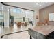 Bright glass-enclosed office off the living room provides view of the outside scenery at 6361 Kenzie Cir, Castle Pines, CO 80108