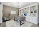 Bright home office with custom built-ins, statement lighting, and a modern desk at 6361 Kenzie Cir, Castle Pines, CO 80108