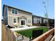 A spacious backyard with a well-maintained lawn, fenced for privacy, and a patio for outdoor living at 2300 Mountain Sky Dr, Fort Lupton, CO 80621