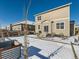 Backyard with patio and snow cover at 2300 Mountain Sky Dr, Fort Lupton, CO 80621