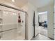 Clean bathroom with walk-in shower and linen closet at 2300 Mountain Sky Dr, Fort Lupton, CO 80621