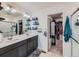 Modern bathroom with double vanity, large walk-in shower, and walk-in closet at 2300 Mountain Sky Dr, Fort Lupton, CO 80621