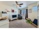Bright bedroom with carpet flooring, ceiling fan, and charming furniture and decor at 2300 Mountain Sky Dr, Fort Lupton, CO 80621