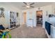 Bedroom with carpet flooring, neutral paint and furniture plus a walk-in closet and ceiling fan at 2300 Mountain Sky Dr, Fort Lupton, CO 80621
