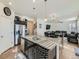Open concept kitchen with a large island and stainless steel appliances at 2300 Mountain Sky Dr, Fort Lupton, CO 80621