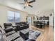 Open living room with adjoining kitchen and dining area at 2300 Mountain Sky Dr, Fort Lupton, CO 80621