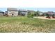 Community playground with grassy areas providing a recreational space for residents and children at 2300 Mountain Sky Dr, Fort Lupton, CO 80621
