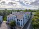 Gray townhomes with mountain views, exterior stairs, and mature trees at 7452 Singing Hills Dr, Boulder, CO 80301