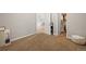 Bedroom with neutral decor, soft carpet, closet, and open doorway leading to additional living space at 7452 Singing Hills Dr, Boulder, CO 80301