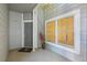Cozy gray townhome entryway featuring modern door and window at 7452 Singing Hills Dr, Boulder, CO 80301