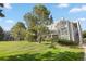 Well-maintained property with lush landscaping and mature trees, offering a serene and inviting atmosphere at 7452 Singing Hills Dr, Boulder, CO 80301