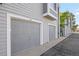 Attached garages with gray doors and white trim are accessible from the driveway at 7452 Singing Hills Dr, Boulder, CO 80301