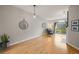 Bright living room with hardwood floors, fireplace, and sliding door to balcony at 7452 Singing Hills Dr, Boulder, CO 80301