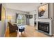 Charming living room featuring fireplace, balcony access, and comfortable seating at 7452 Singing Hills Dr, Boulder, CO 80301