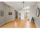 Open living room with hardwood floors, fireplace, and eat-in kitchen access at 7452 Singing Hills Dr, Boulder, CO 80301