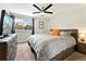 Cozy bedroom with a large window, ceiling fan, and neutral decor that creates a relaxing atmosphere at 1350 Josephine St # 307, Denver, CO 80206
