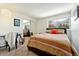 Bright bedroom with large window and modern lighting offering relaxation at 1350 Josephine St # 307, Denver, CO 80206