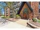 Inviting Dublin Terrace entrance featuring a brick facade, a garden area, and well-maintained landscaping at 1350 Josephine St # 307, Denver, CO 80206
