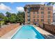 Inviting outdoor pool with lounge chairs and a building in the background, perfect for relaxation and recreation at 1350 Josephine St # 307, Denver, CO 80206
