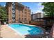 Inviting outdoor pool with lounge chairs and a building in the background, perfect for relaxation and recreation at 1350 Josephine St # 307, Denver, CO 80206