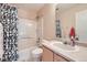 Clean bathroom with shower/tub combo, vanity, and mirror at 14804 E 118Th Pl, Commerce City, CO 80603