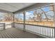 A view from the porch reveals a backyard and a serene, open field beyond at 15499 Kearney St, Brighton, CO 80602