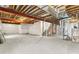 Unfinished basement area with exposed ceiling and wrapped walls, awaiting personalization at 15499 Kearney St, Brighton, CO 80602