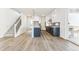 Modern kitchen with white cabinets, island and stainless steel appliances at 15499 Kearney St, Brighton, CO 80602
