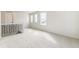 Bright loft area featuring neutral carpet and three windows, providing lots of natural light at 15499 Kearney St, Brighton, CO 80602