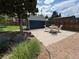Backyard patio with an outdoor dining set beside a storage shed at 10130 W 20Th Ave, Lakewood, CO 80215