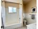 Clean bathroom showcasing a tub, shower and a classic white tile surround at 10130 W 20Th Ave, Lakewood, CO 80215