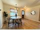 Charming dining area with a modern table set, hardwood floors, and abundant natural light at 10130 W 20Th Ave, Lakewood, CO 80215