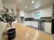 Bright kitchen with white cabinetry, stainless steel appliances, and a butcher block island at 10130 W 20Th Ave, Lakewood, CO 80215