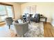 Comfortable living room with stylish seating, a soft rug, and bright natural light at 10130 W 20Th Ave, Lakewood, CO 80215
