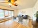 Cozy living room with large windows, hardwood flooring, modern furnishings and ceiling fan at 10130 W 20Th Ave, Lakewood, CO 80215