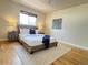 Bright main bedroom features hardwood floors, neutral walls, and lots of natural light at 10130 W 20Th Ave, Lakewood, CO 80215
