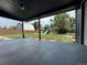 Covered patio overlooking a lush backyard with a playground and a traditional barn at 10130 W 20Th Ave, Lakewood, CO 80215