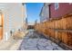 Private backyard featuring a stone walkway surrounded by fencing at 11440 E 26Th Ave, Aurora, CO 80010