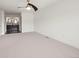 Spacious bedroom features neutral carpet, a ceiling fan, and easy access to the ensuite bathroom with double sinks at 1011 Pierce St # 11, Lakewood, CO 80214