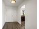 Bright hallway with wood floors, leading to the kitchen at 1011 Pierce St # 11, Lakewood, CO 80214