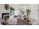 Bright living room with a modern fireplace, neutral decor, comfortable seating, and ample natural light at 1011 Pierce St # 11, Lakewood, CO 80214