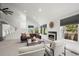 Spacious living room with vaulted ceiling, fireplace, comfortable seating, and ample natural light at 1011 Pierce St # 11, Lakewood, CO 80214