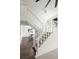 Bright and open staircase with carpeted steps and views into the dining area at 1011 Pierce St # 11, Lakewood, CO 80214