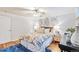 Cozy bedroom with hardwood floors and ceiling fan at 10 N Ogden St # 5, Denver, CO 80218