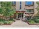 The building entrance features stone accents, planters, and ample sunlight at 10 N Ogden St # 5, Denver, CO 80218
